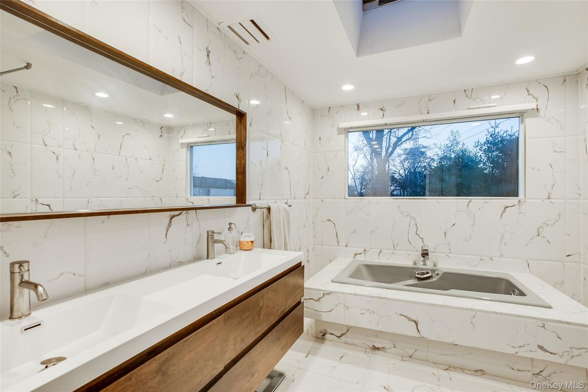 Bathroom, Dual Sink Vanities, Interior, Marble, Marble Walls, Recessed Lighting