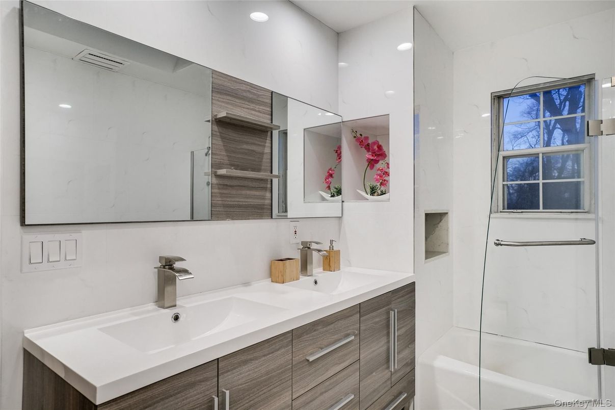 Bathroom, Dual Sink Vanities, Glass Shower, Interior, Marble Walls, Recessed Lighting