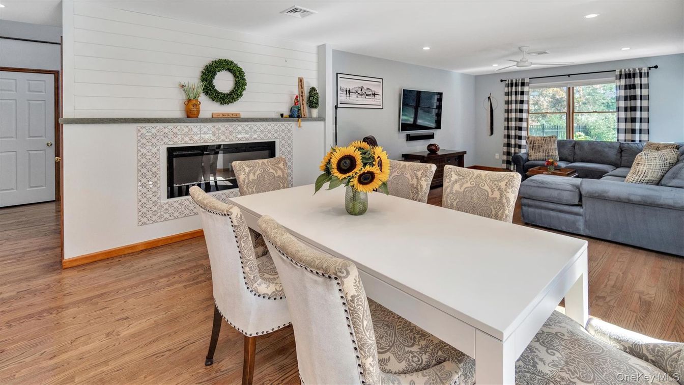 Dining room, Fireplace, Interior, Living room, Recessed Lighting, Wood Texture Flooring