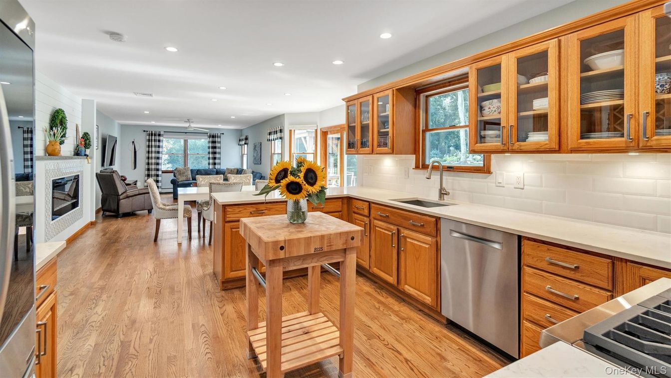 Dining room, Fireplace, Interior, Kitchen, Living room, Recessed Lighting, Stainless Steel Appliances, Wood Texture Flooring