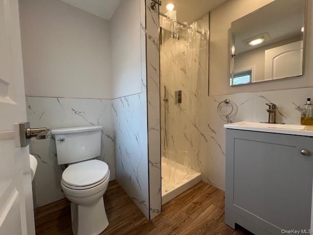 Bathroom, Glass Shower, Interior, Marble Walls, Recessed Lighting, Wood Texture Flooring