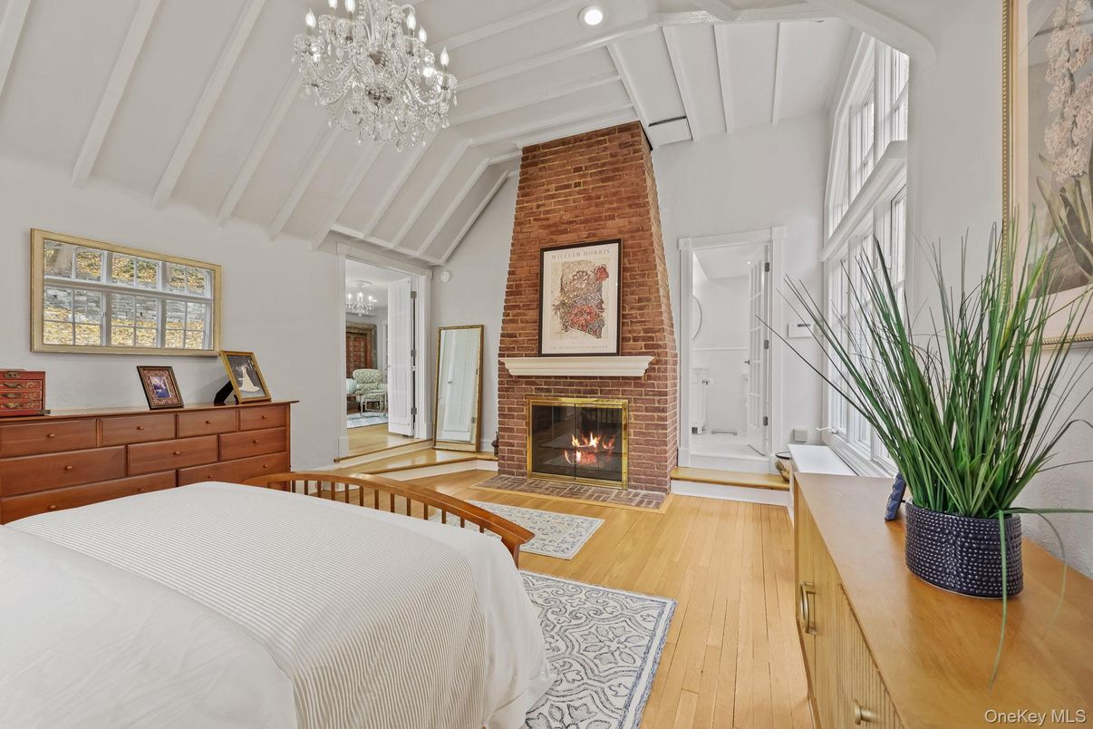 Bedroom, Chandelier, Fireplace, Interior, Recessed Lighting, Wood Texture Flooring
