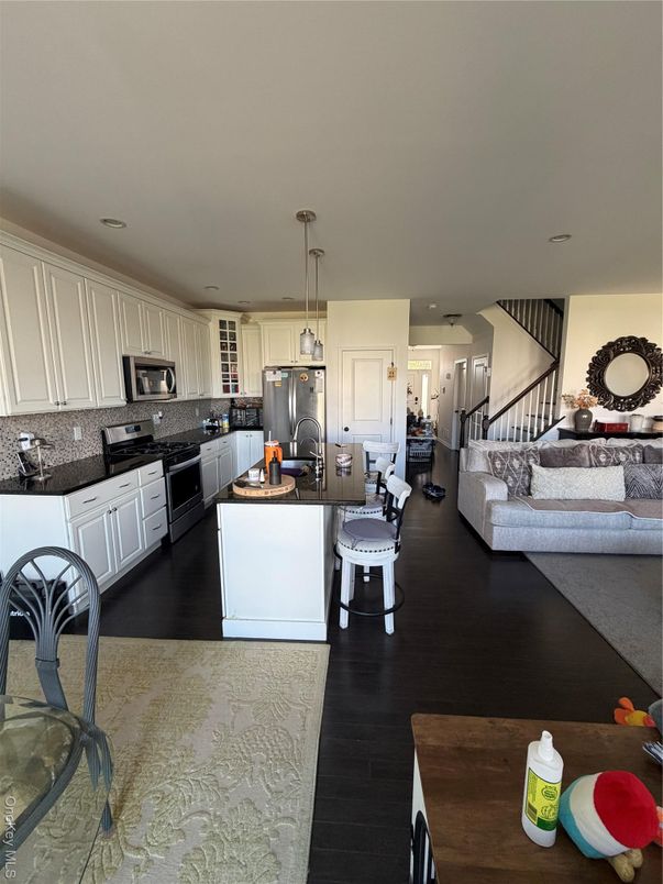 Dining room, Interior, Kitchen, Living room, Pendant Lights, Recessed Lighting, Stainless Steel Appliances, Wood Texture Flooring