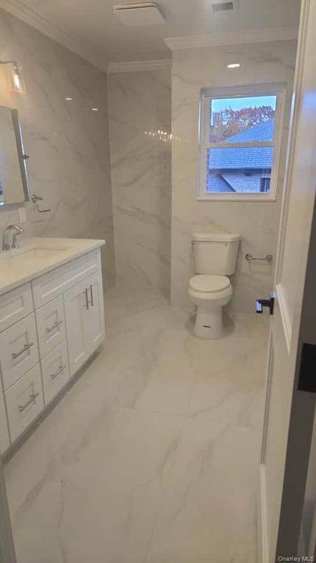 Bathroom, Dual Sink Vanities, Interior, Marble, Marble Walls, Recessed Lighting