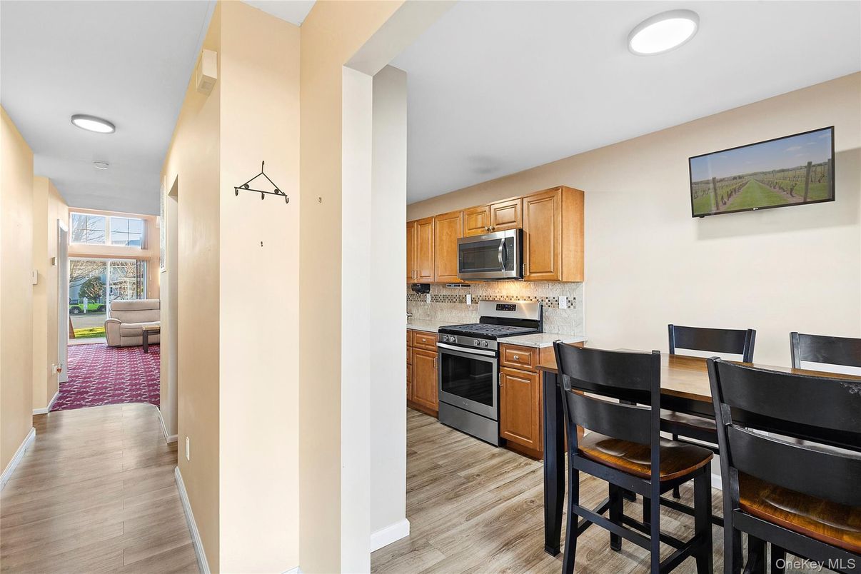 Dining room, Interior, Kitchen, Recessed Lighting, Stainless Steel Appliances, Wood Texture Flooring