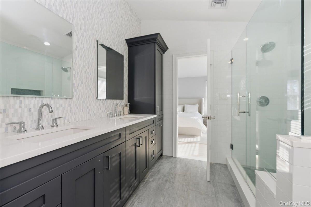 Bathroom, Bedroom, Dual Sink Vanities, Glass Shower, Interior, Recessed Lighting, Wood Texture Flooring