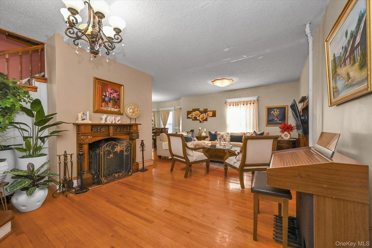 Chandelier, Dining room, Fireplace, Interior, Living room, Piano, Wood Texture Flooring