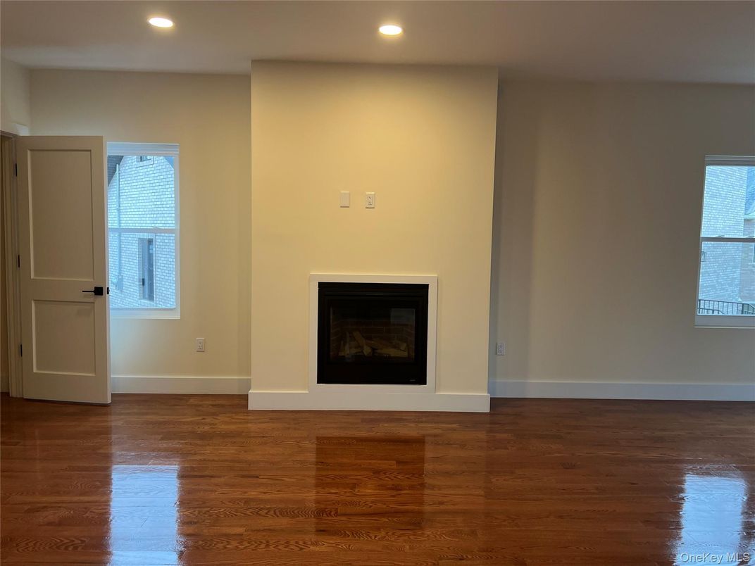 Empty room, Fireplace, Interior, Recessed Lighting, Wood Texture Flooring