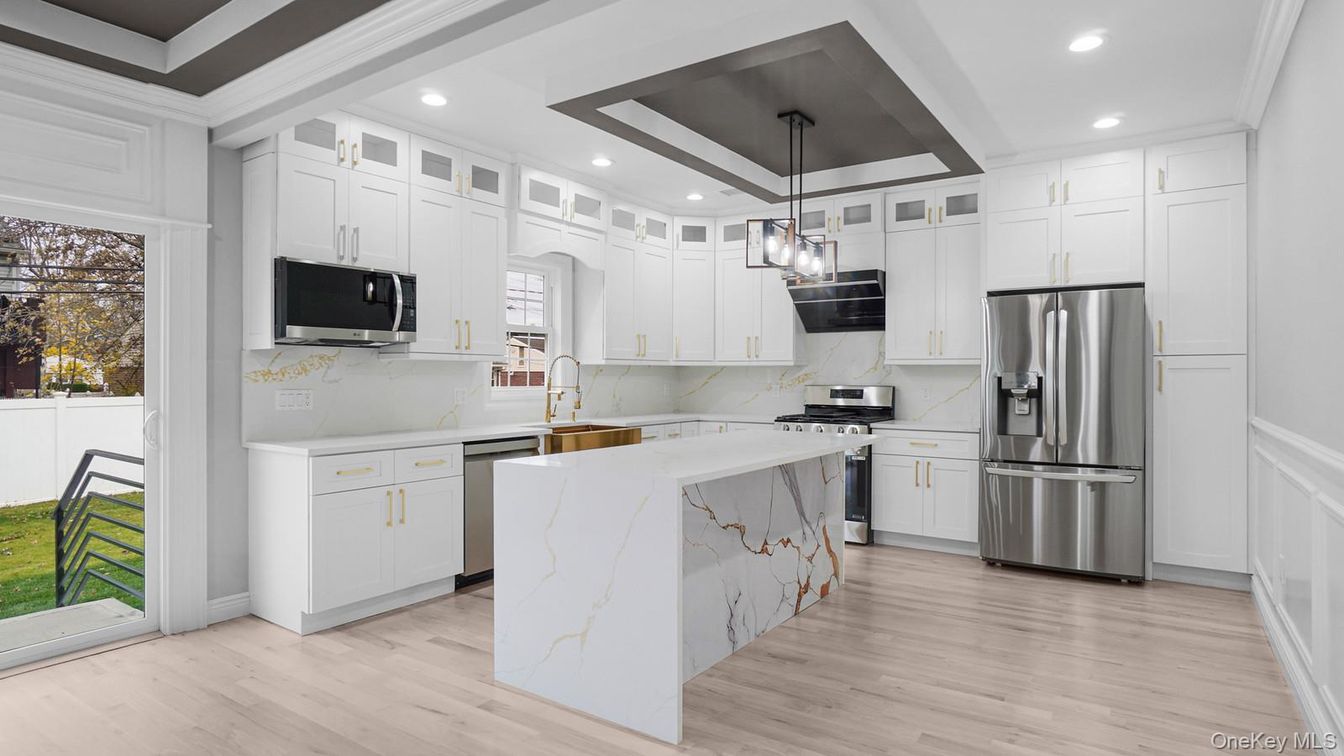 Interior, Kitchen, Marble Walls, Pendant Lights, Recessed Lighting, Stainless Steel Appliances, Wood Texture Flooring