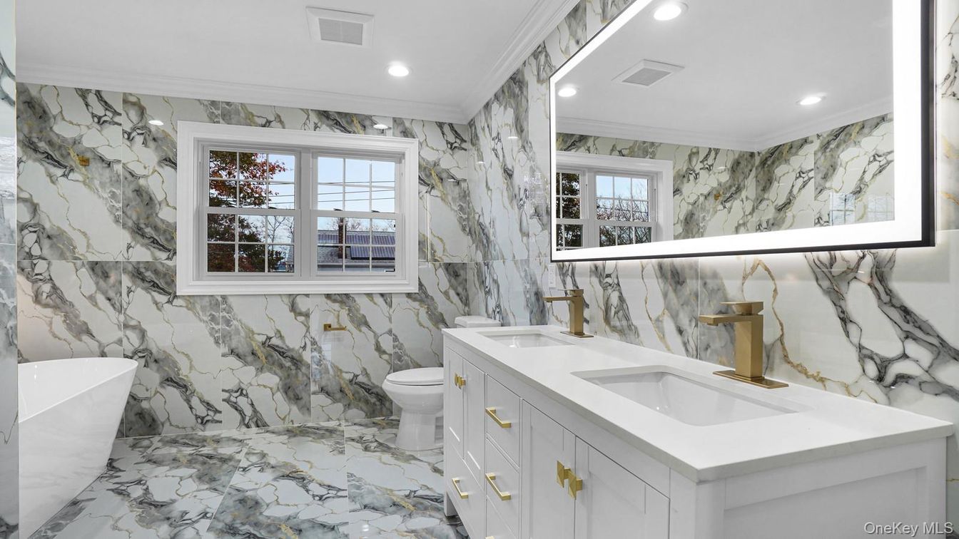 Bathroom, Dual Sink Vanities, Free Standing Baths, Interior, Marble, Marble Walls, Recessed Lighting