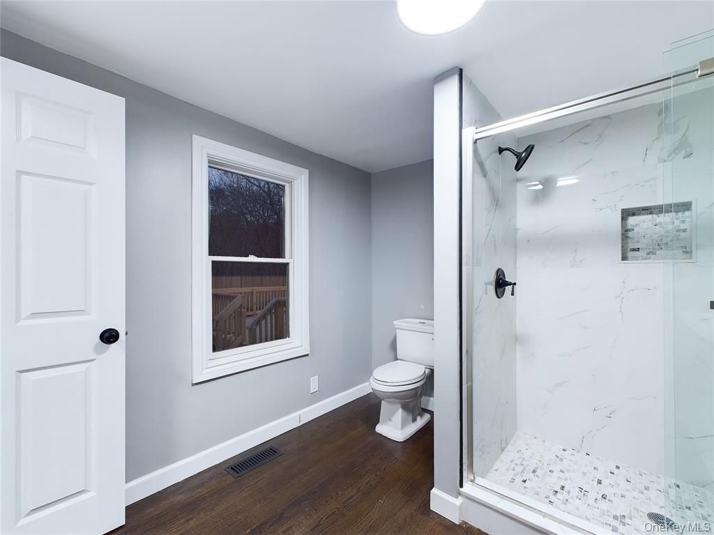 Bathroom, Glass Shower, Interior, Marble Walls, Wood Texture Flooring