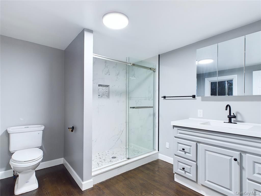 Bathroom, Glass Shower, Interior, Marble Walls, Recessed Lighting, Wood Texture Flooring