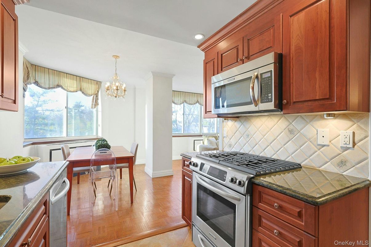 Chandelier, Dining room, Interior, Kitchen, Recessed Lighting, Stainless Steel Appliances, Wood Texture Flooring