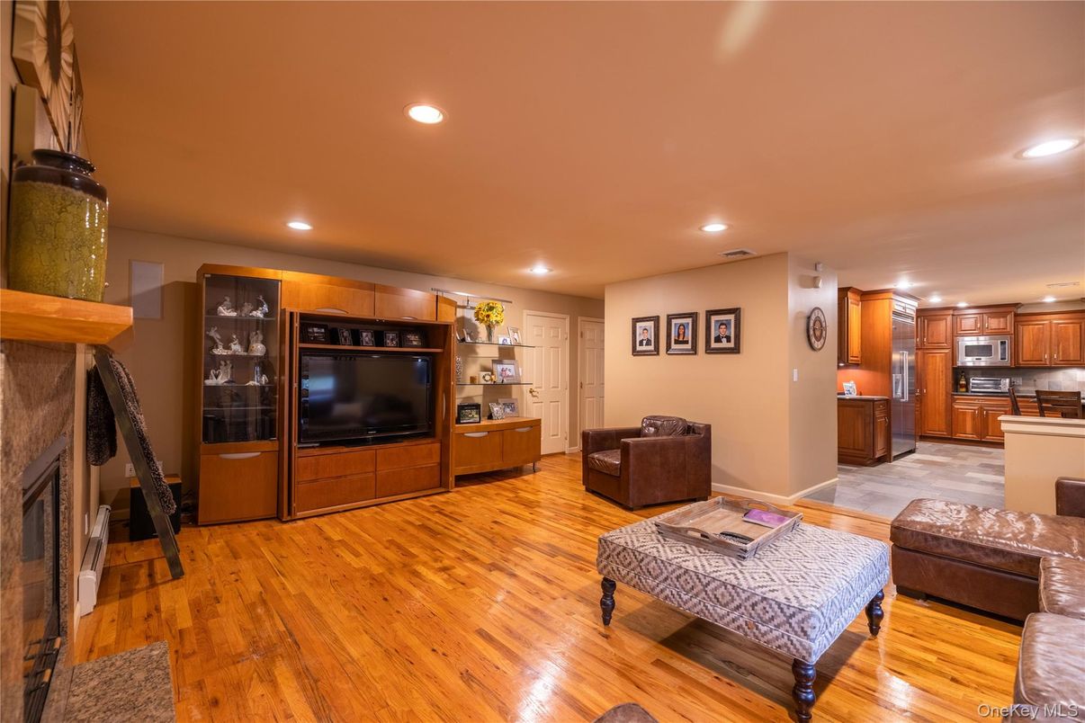 Fireplace, Interior, Kitchen, Living room, Recessed Lighting, Stainless Steel Appliances, Wood Texture Flooring