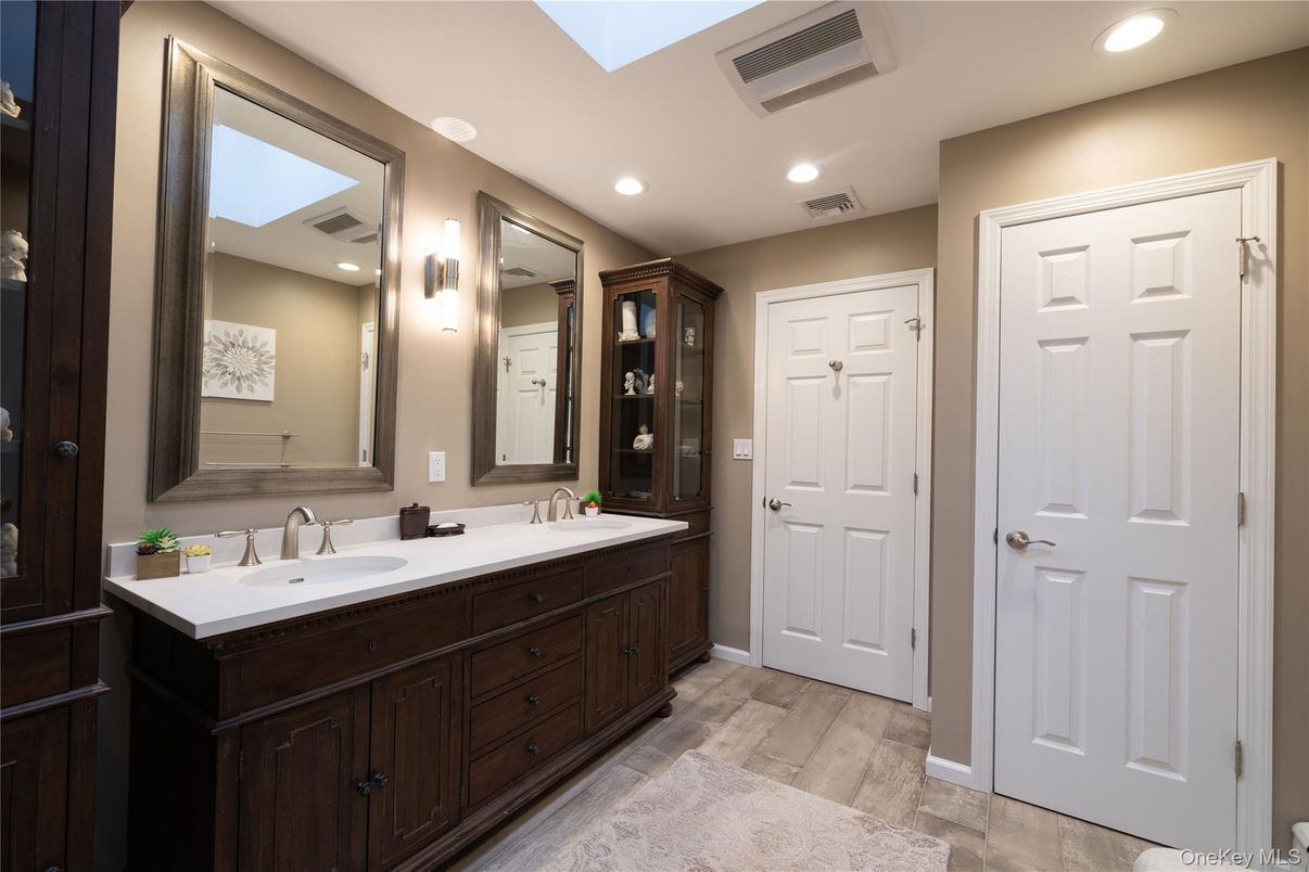 Bathroom, Dual Sink Vanities, Interior, Recessed Lighting, Wood Texture Flooring