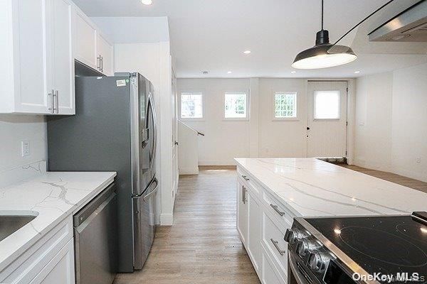 Interior, Kitchen, Pendant Lights, Recessed Lighting, Stainless Steel Appliances, Wood Texture Flooring