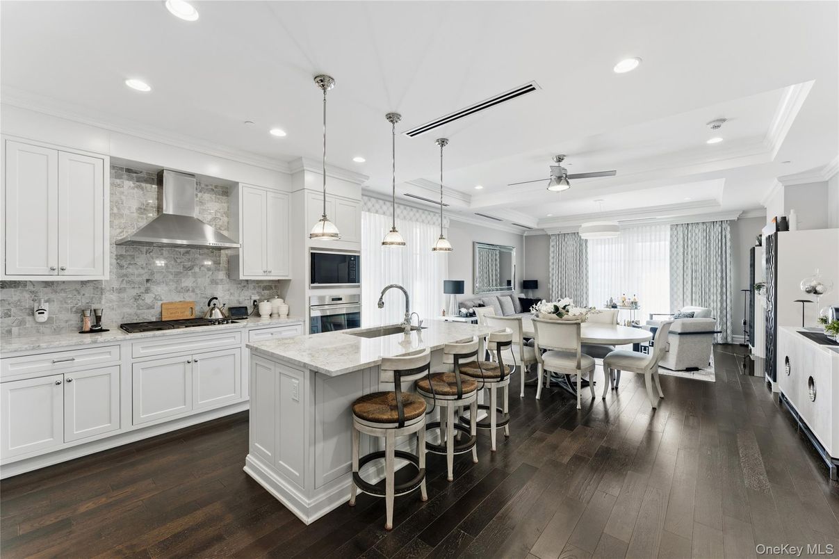 Dining room, Interior, Kitchen, Pendant Lights, Recessed Lighting, Stainless Steel Appliances, Wood Texture Flooring