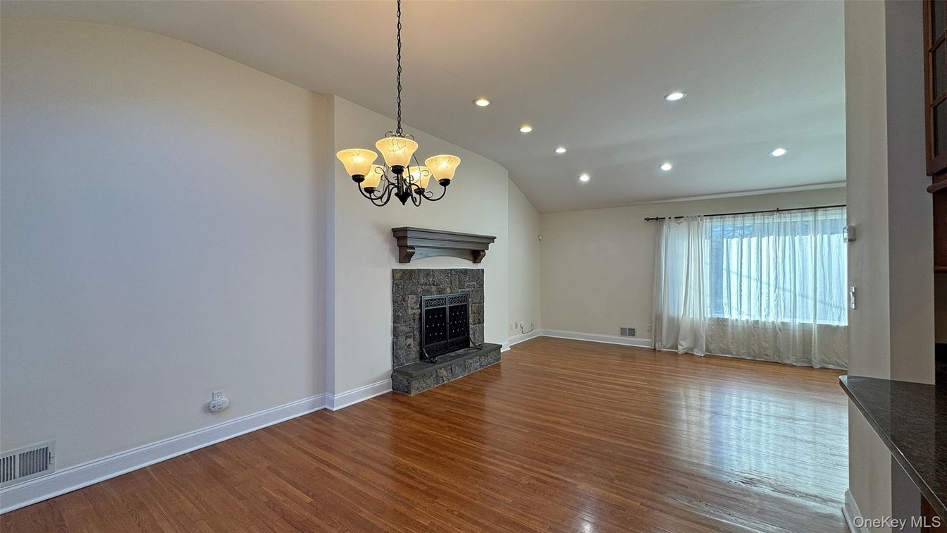 Chandelier, Empty room, Fireplace, Interior, Recessed Lighting, Wood Texture Flooring