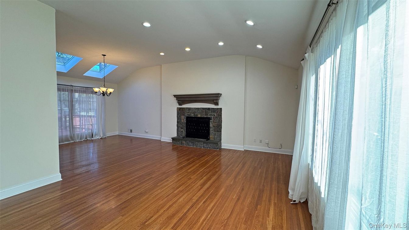 Chandelier, Empty room, Fireplace, Interior, Recessed Lighting, Wood Texture Flooring