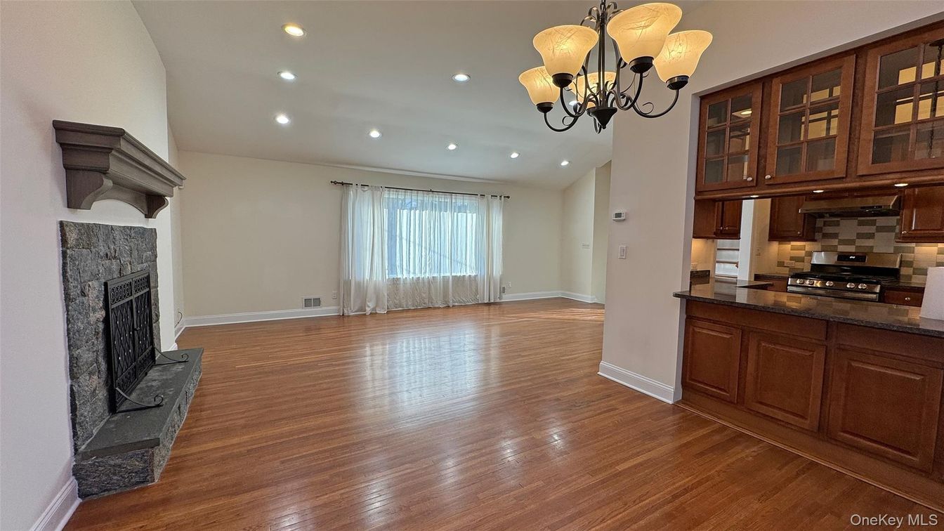 Chandelier, Fireplace, Interior, Kitchen, Recessed Lighting, Wood Texture Flooring