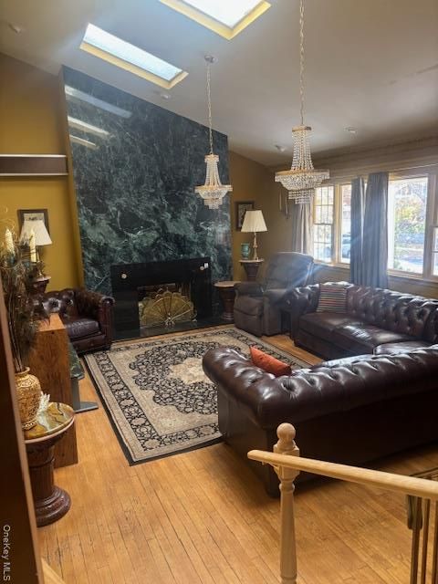 Chandelier, Fireplace, Interior, Living room, Marble Walls, Pendant Lights, Wood Texture Flooring