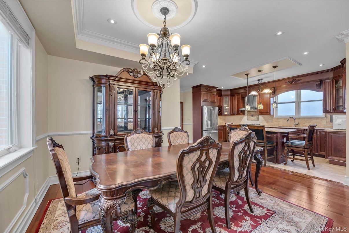 Chandelier, Dining room, Interior, Kitchen, Pendant Lights, Recessed Lighting, Stainless Steel Appliances, Water, Wood Texture Flooring