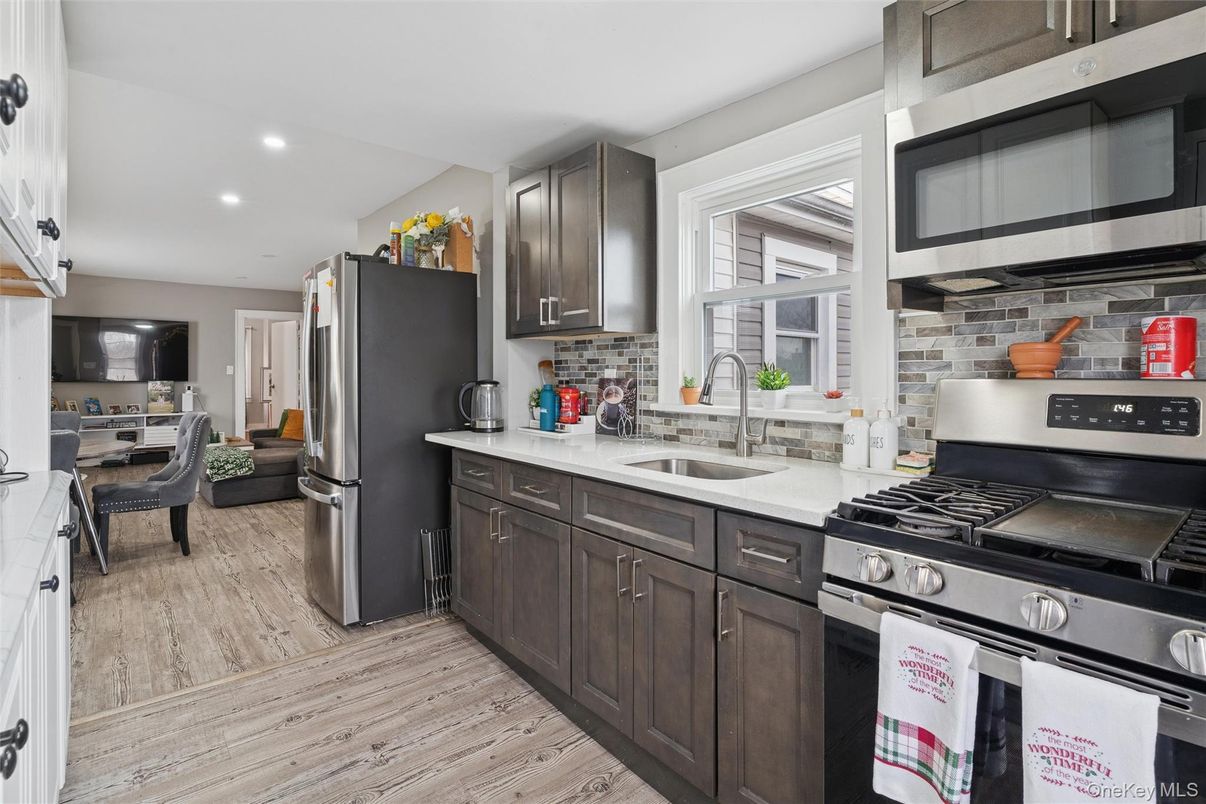 Dining room, Interior, Kitchen, Recessed Lighting, Stainless Steel Appliances, Wood Texture Flooring