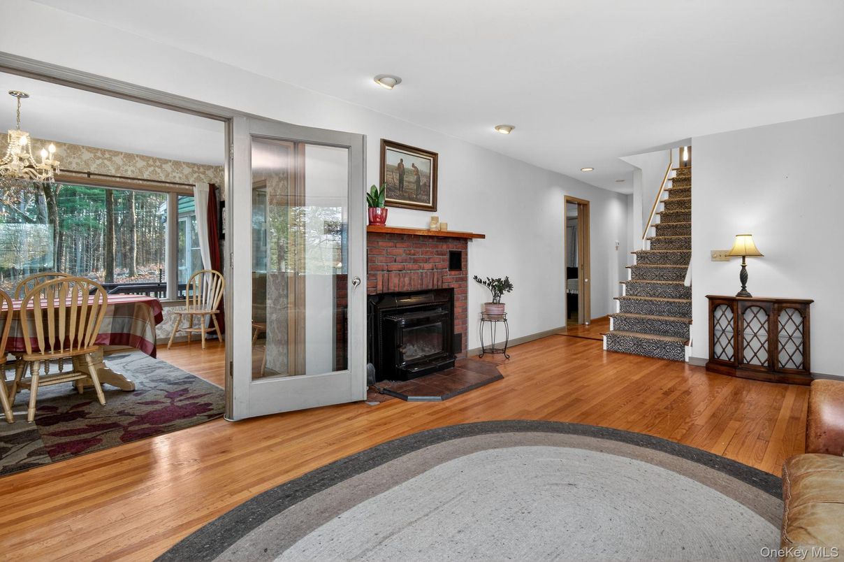 Chandelier, Dining room, Fireplace, Interior, Recessed Lighting, Wood Texture Flooring