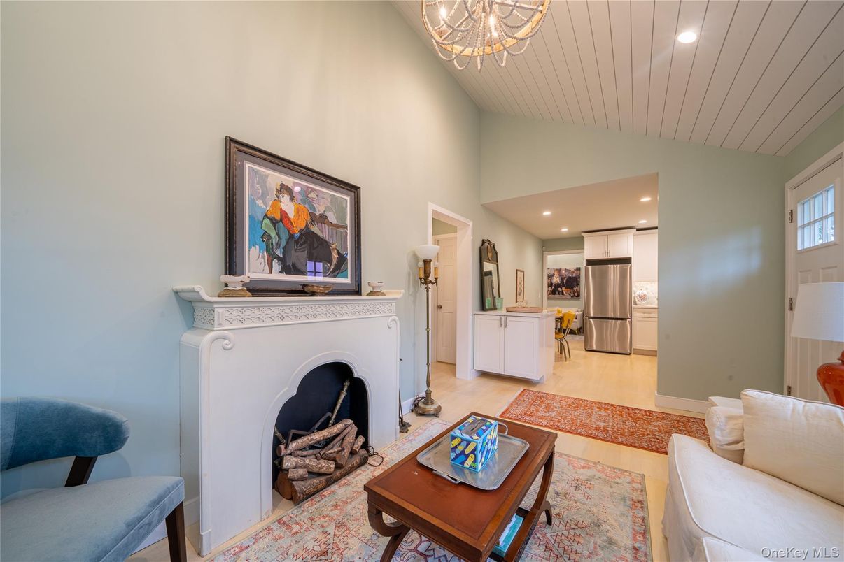 Fireplace, Interior, Kitchen, Living room, Recessed Lighting, Stainless Steel Appliances, Wood Texture Flooring