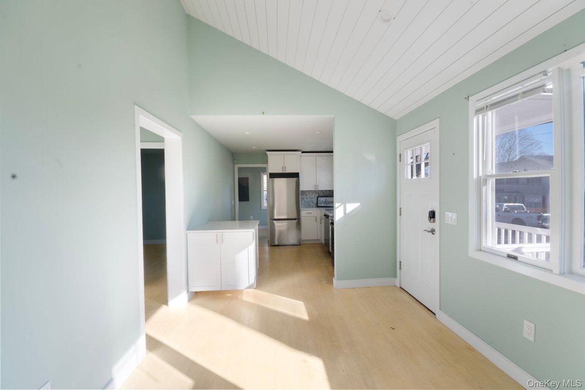 Empty room, Interior, Kitchen, Recessed Lighting, Stainless Steel Appliances, Wood Texture Flooring