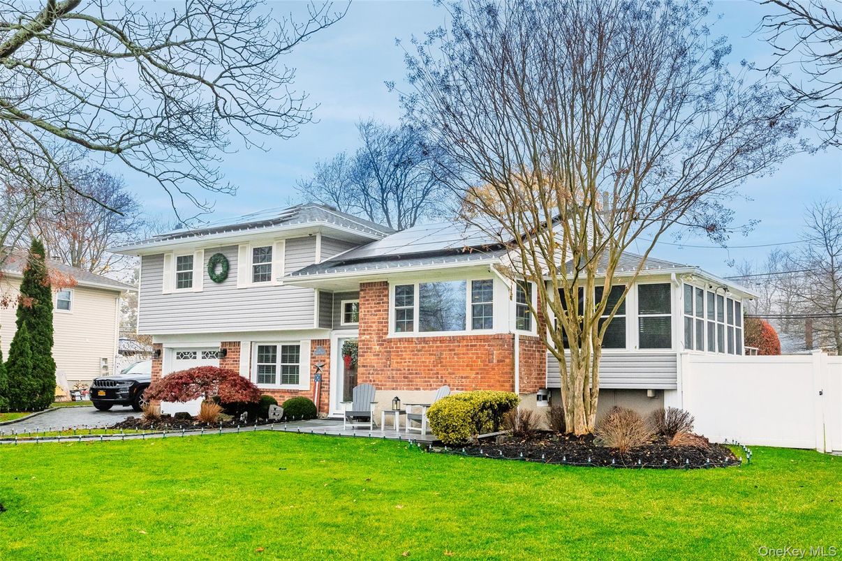 Attached, Exterior, Facade, Brick Facade, Solar Panels, Split Level