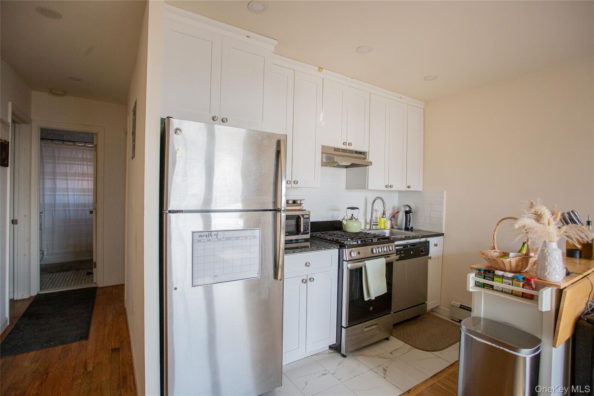 Interior, Kitchen, Marble, Recessed Lighting, Stainless Steel Appliances, Wood Texture Flooring