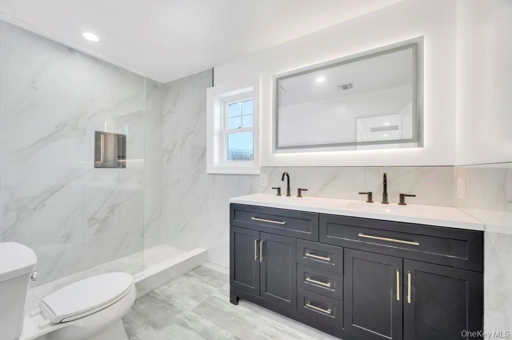 Bathroom, Dual Sink Vanities, Glass Shower, Interior, Marble Walls, Recessed Lighting