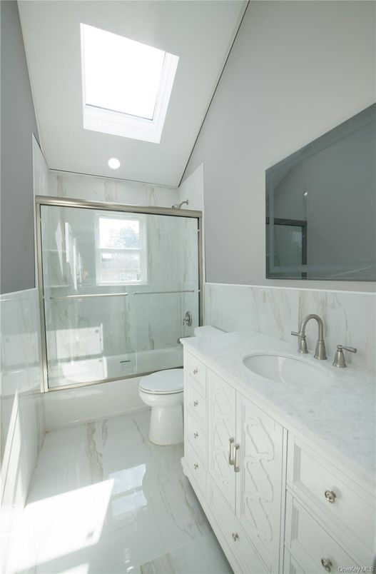 Bathroom, Dual Sink Vanities, Glass Shower, Interior, Marble, Marble Walls, Recessed Lighting