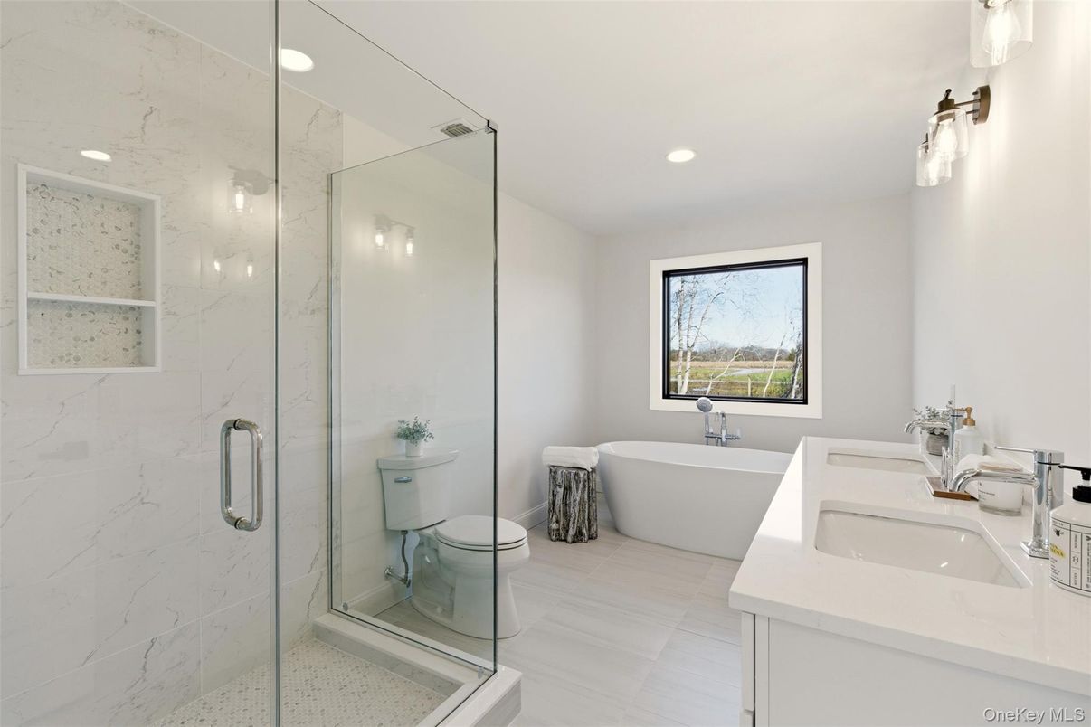 Bathroom, Dual Sink Vanities, Free Standing Baths, Glass Shower, Interior, Marble Walls, Recessed Lighting
