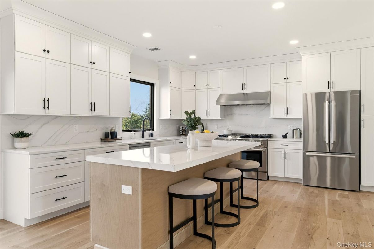 Interior, Kitchen, Marble Walls, Recessed Lighting, Stainless Steel Appliances, Wood Texture Flooring