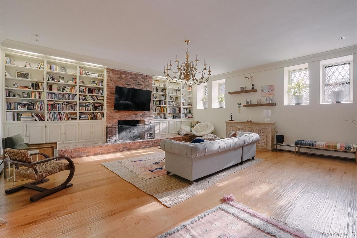 Chandelier, Fireplace, Interior, Living room, Stone Walls, Wood Texture Flooring