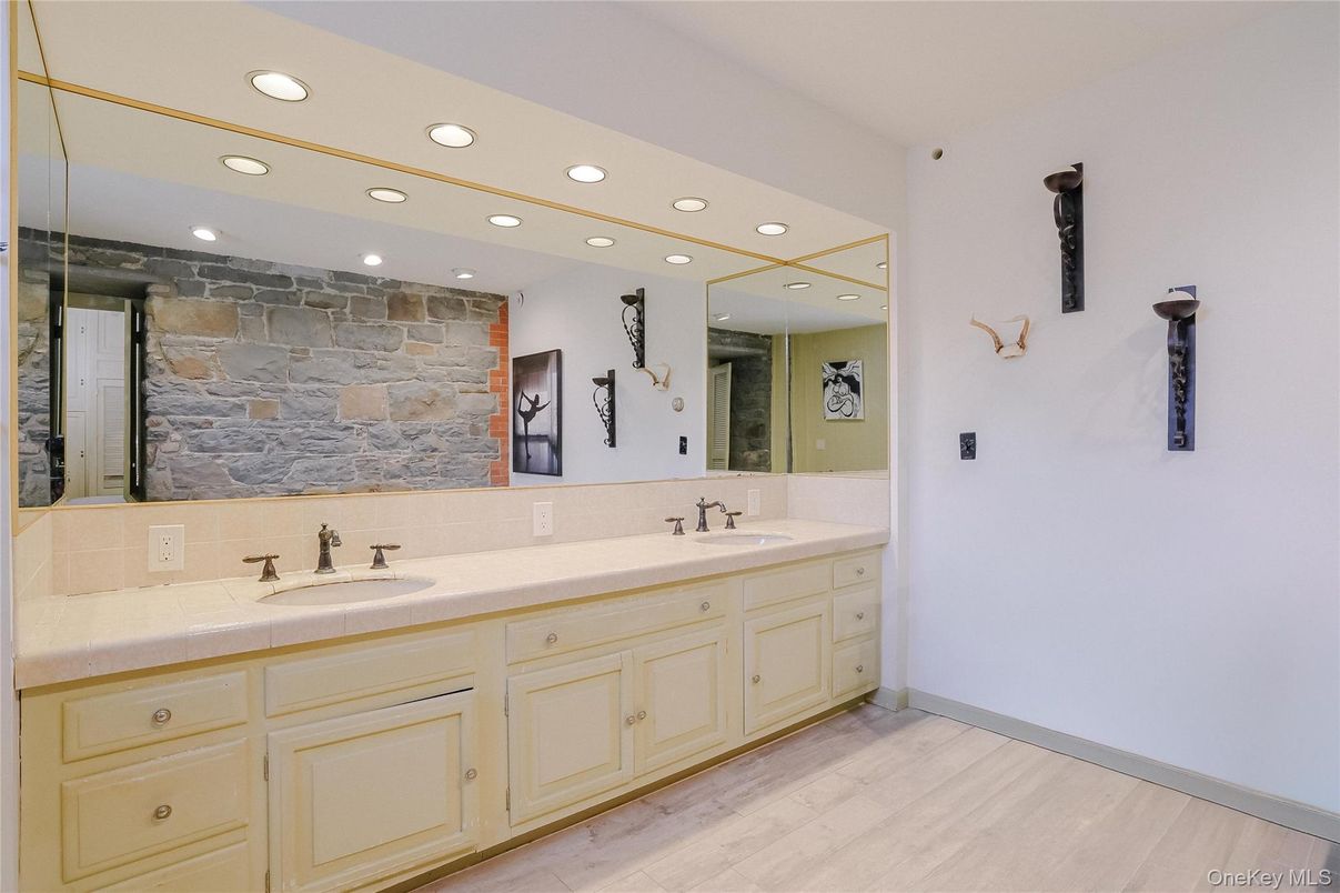 Bathroom, Dual Sink Vanities, Interior, Recessed Lighting, Stone Walls, Tile Countertops, Wood Texture Flooring
