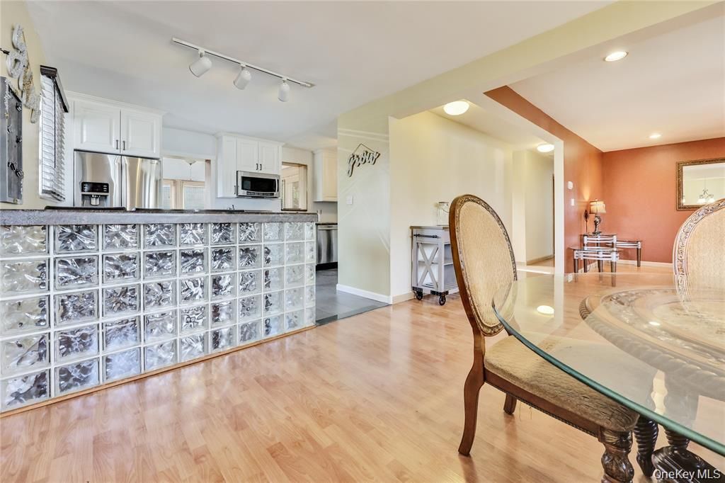 Dining room, Interior, Kitchen, Recessed Lighting, Stainless Steel Appliances, Wood Texture Flooring