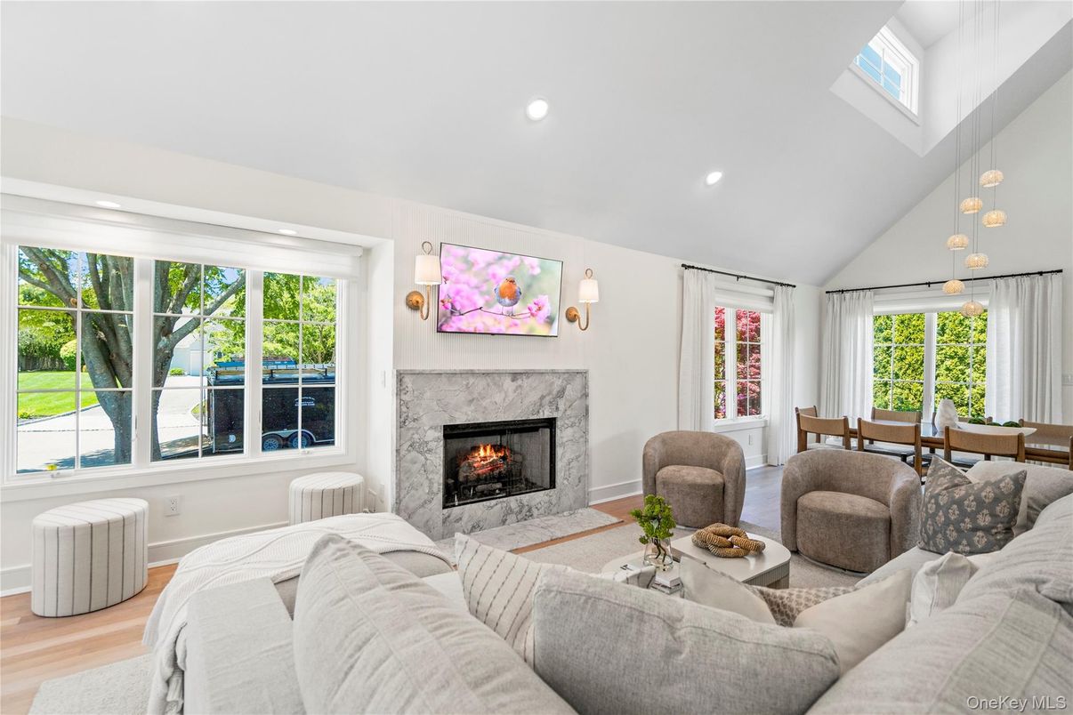 Dining room, Fireplace, Interior, Living room, Pendant Lights, Recessed Lighting, Wood Texture Flooring