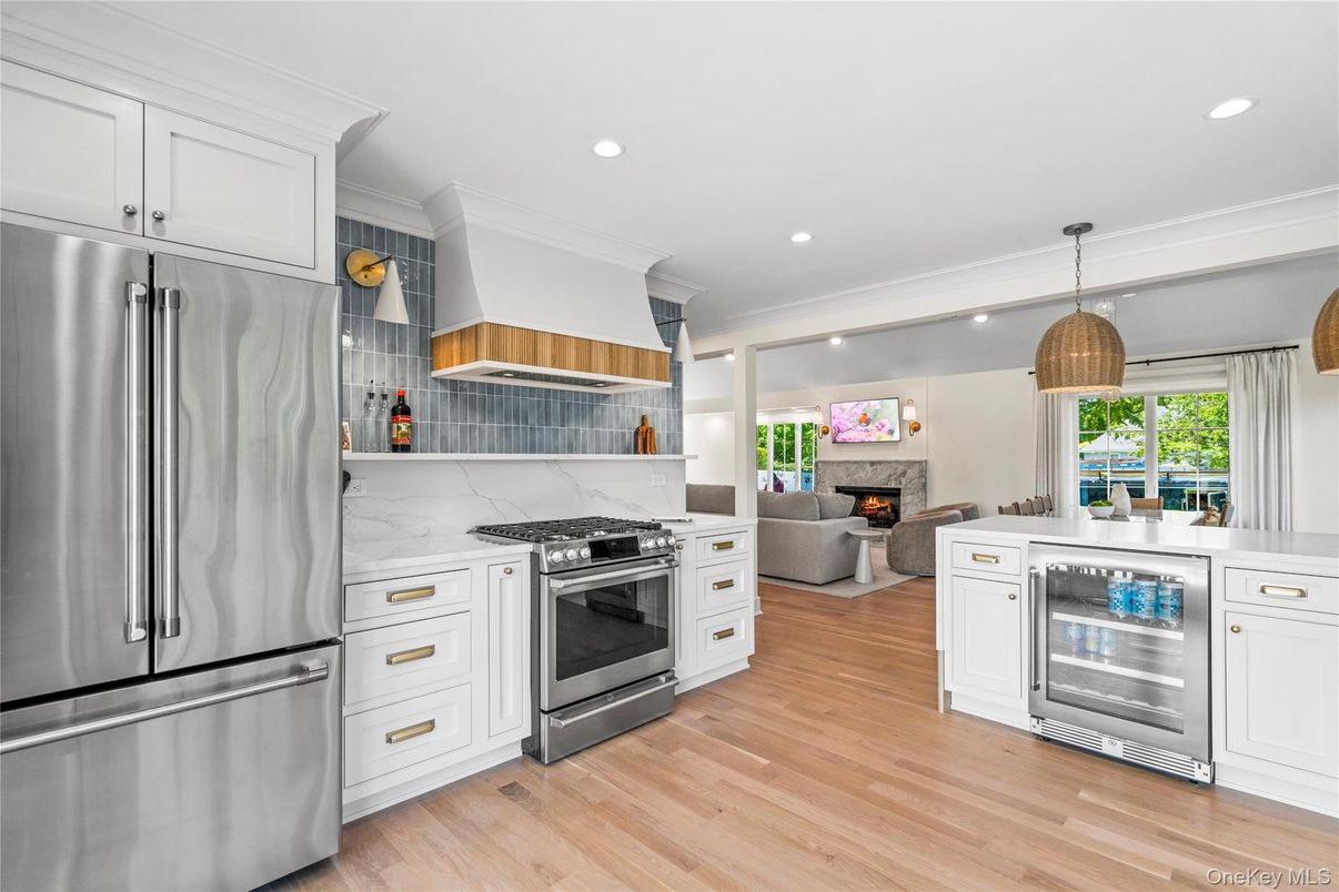 Fireplace, Interior, Kitchen, Living room, Pendant Lights, Recessed Lighting, Stainless Steel Appliances, Wood Texture Flooring