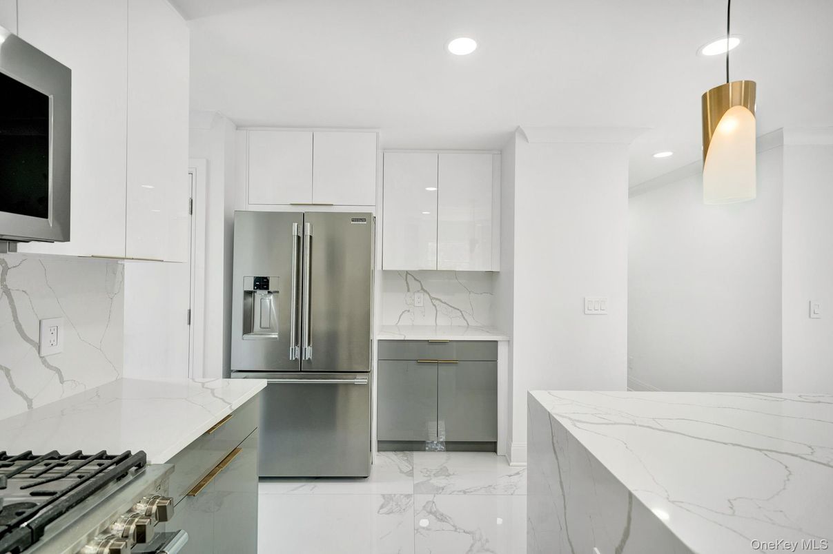 Interior, Kitchen, Marble, Marble Walls, Pendant Lights, Recessed Lighting, Stainless Steel Appliances