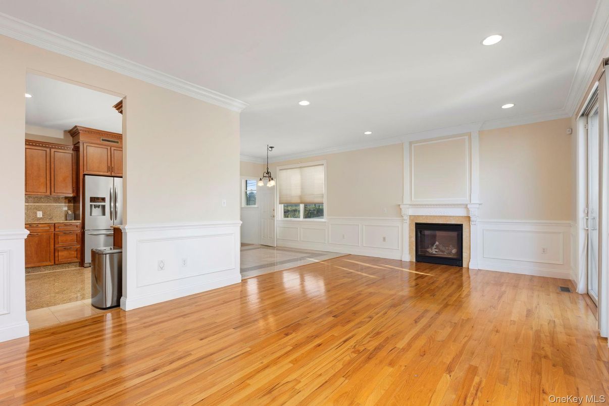 Empty room, Fireplace, Interior, Kitchen, Pendant Lights, Recessed Lighting, Wood Texture Flooring