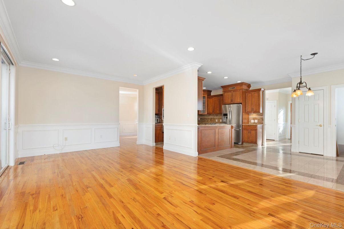 Empty room, Interior, Kitchen, Pendant Lights, Recessed Lighting, Stainless Steel Appliances, Wood Texture Flooring