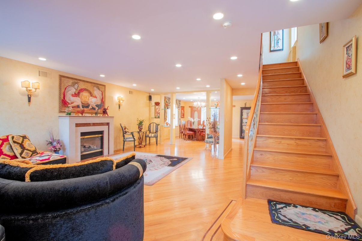 Dining room, Fireplace, Interior, Living room, Recessed Lighting, Wood Texture Flooring