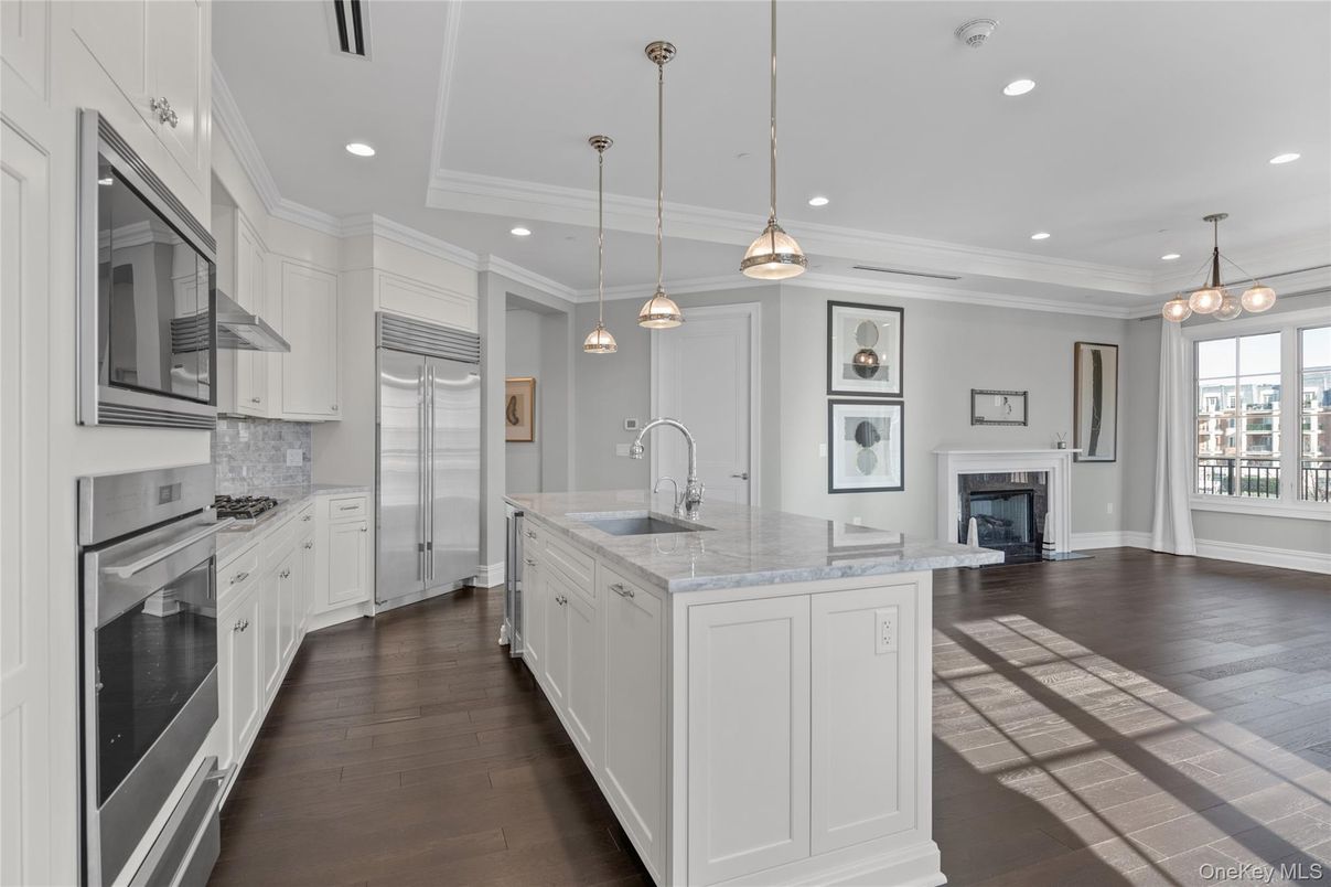 Fireplace, Interior, Kitchen, Pendant Lights, Recessed Lighting, Stainless Steel Appliances, Wood Texture Flooring