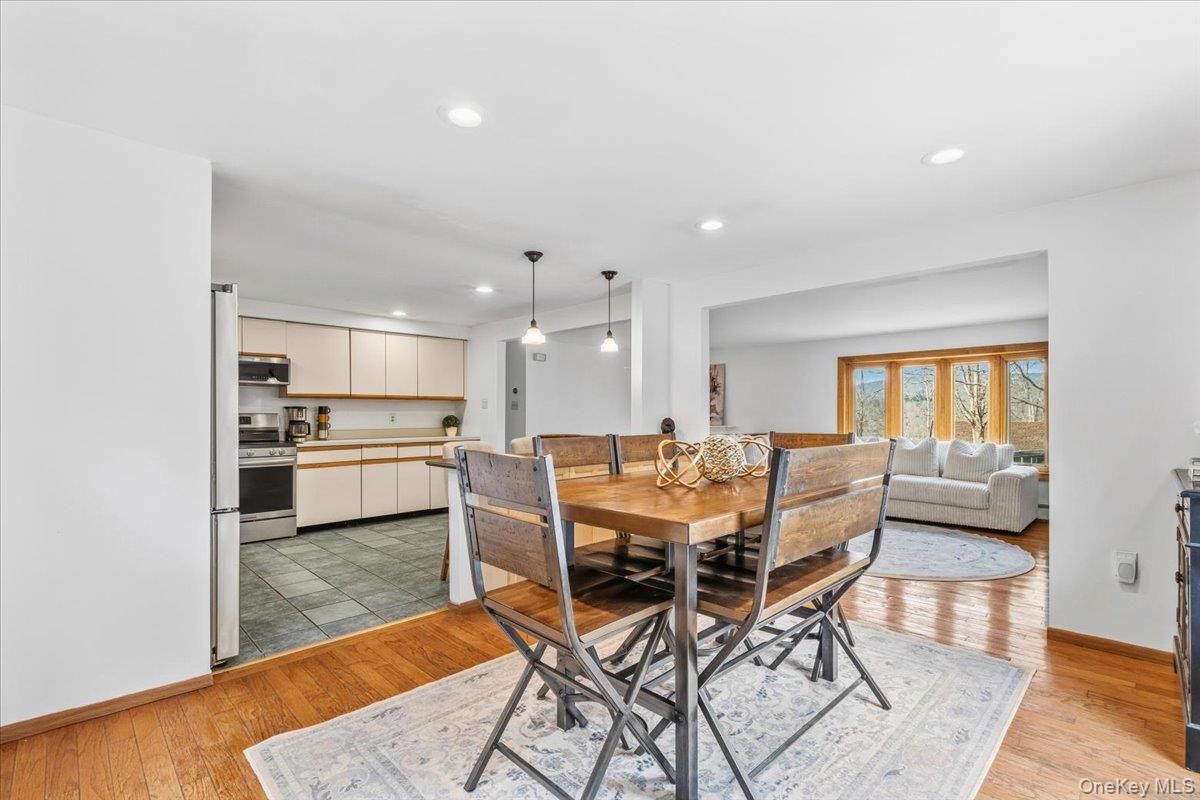 Dining room, Interior, Kitchen, Living room, Pendant Lights, Recessed Lighting, Stainless Steel Appliances, Wood Texture Flooring