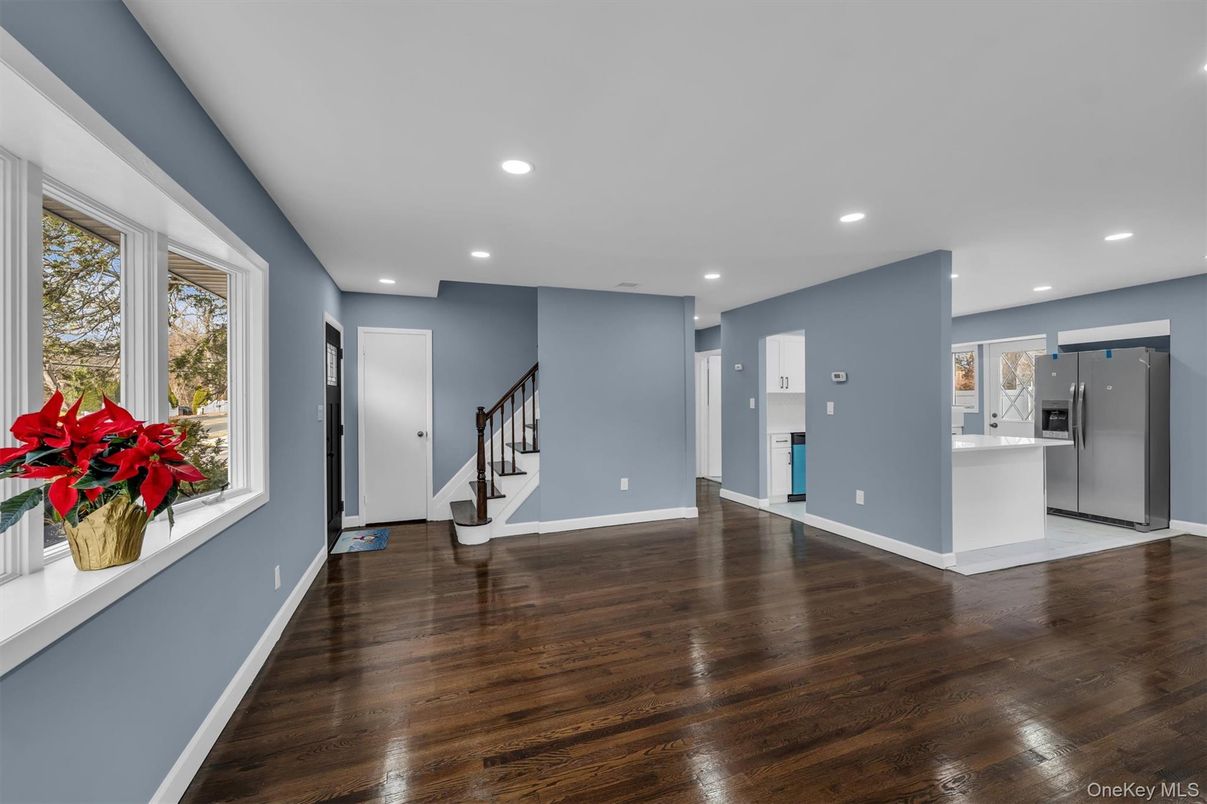 Empty room, Interior, Kitchen, Recessed Lighting, Stainless Steel Appliances, Wood Texture Flooring