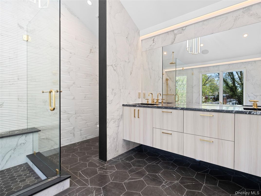 Bathroom, Dual Sink Vanities, Glass Shower, Interior, Marble, Marble Walls, Recessed Lighting