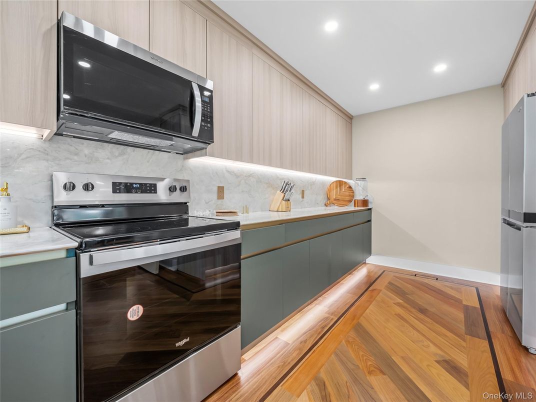 Interior, Kitchen, Marble Walls, Recessed Lighting, Stainless Steel Appliances, Wood Texture Flooring